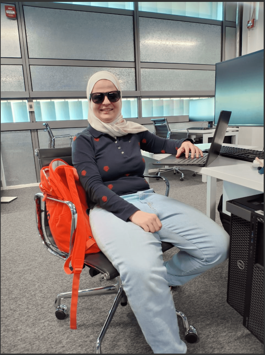 A team member working at a desk in the office
