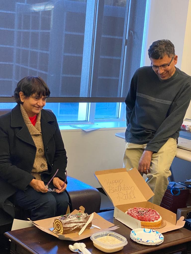Two team members celebrating in the office